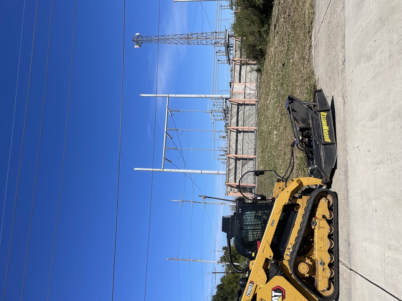 Caterpillar 299D3 with a BrushMonster attachment after mulching brush