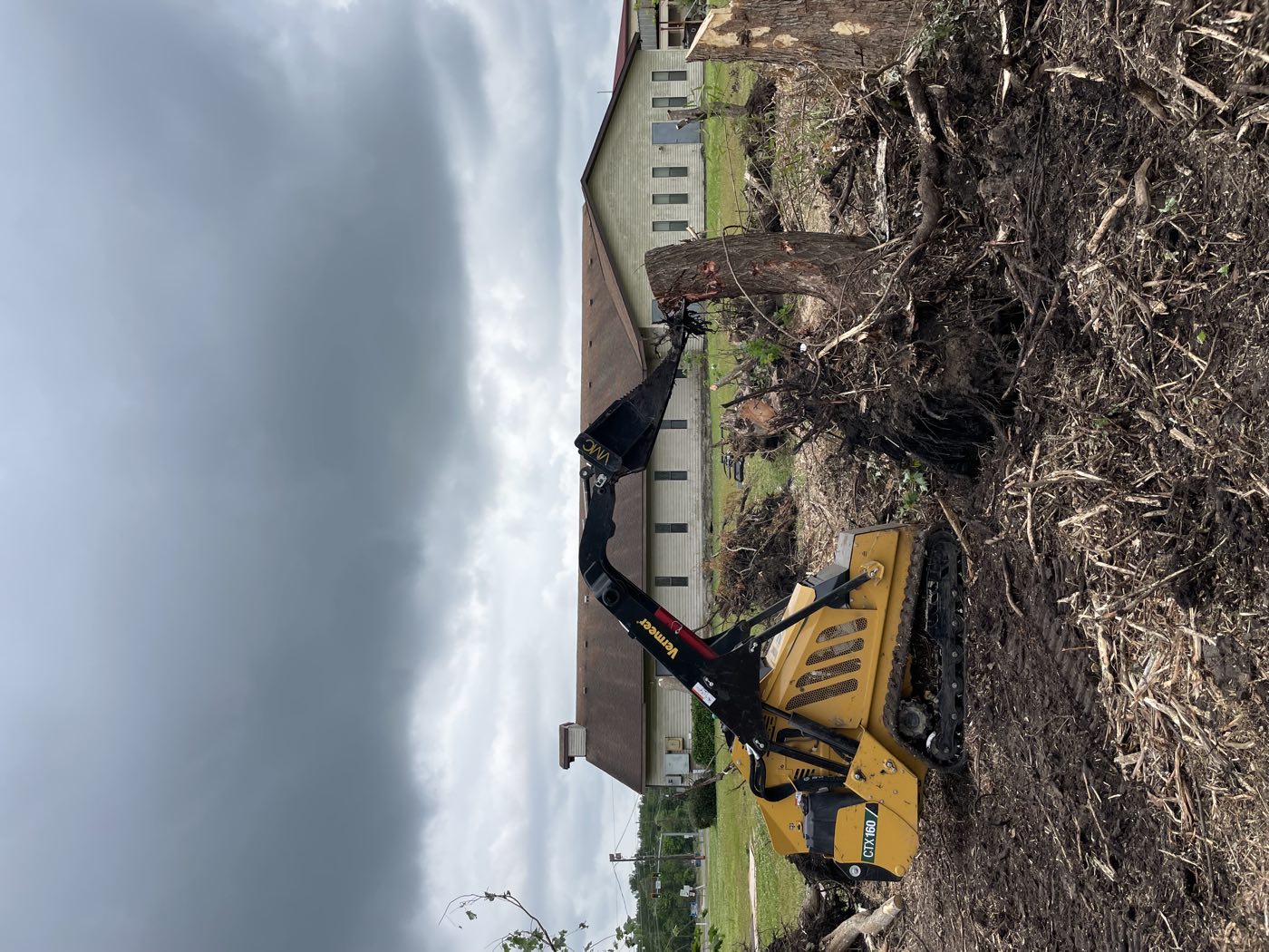 Vermeer CTX 160 pulling stumps and debris on a clearing job