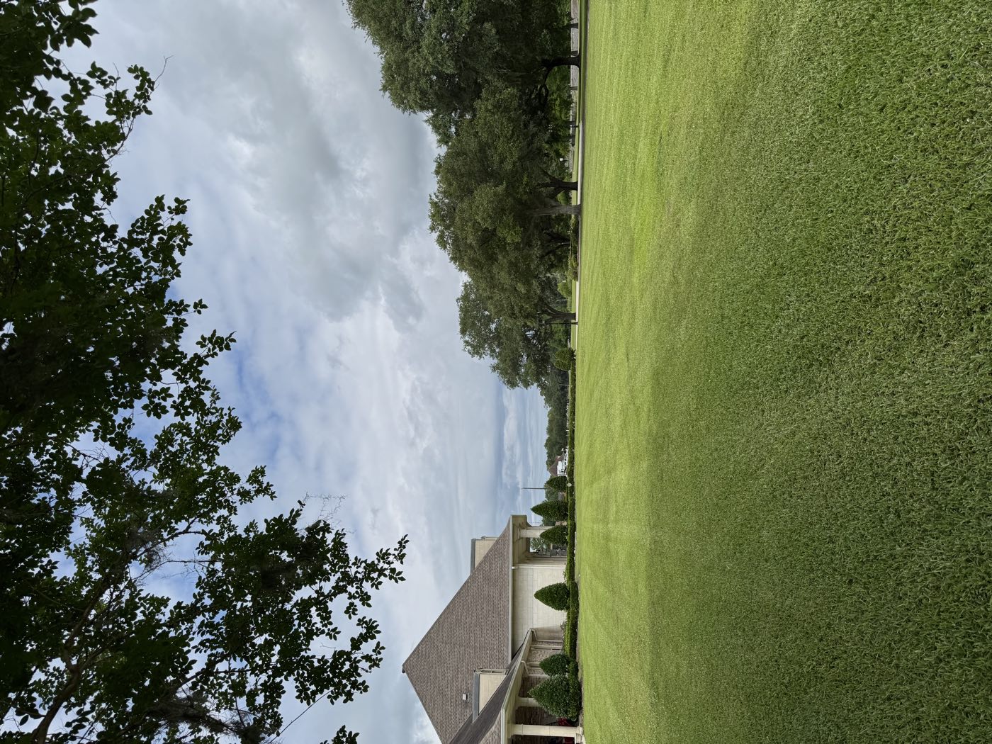 Finished, striped lawn in front of a commercial building